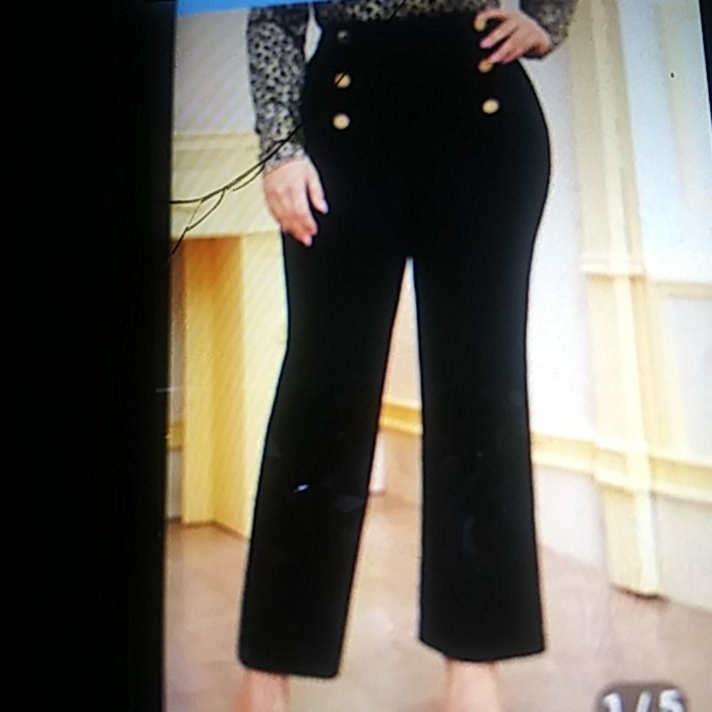 Black ankle length pants with gold buttons